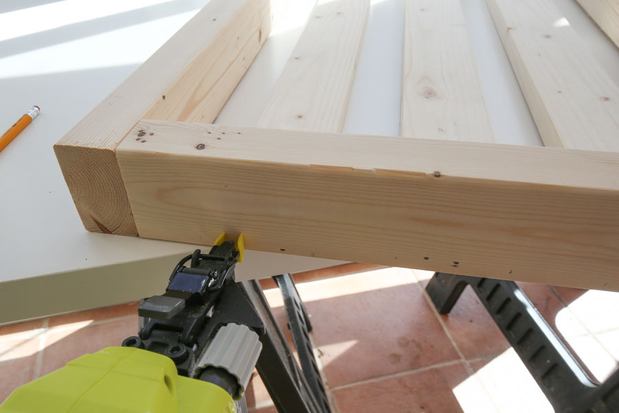 Add side slat boards to chair side frames with brad nailer