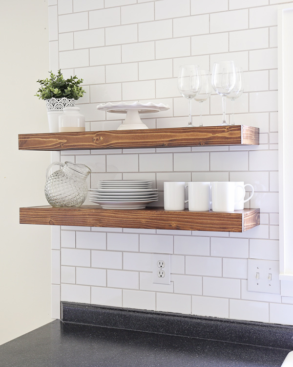 open kitchen shelving against subway tile