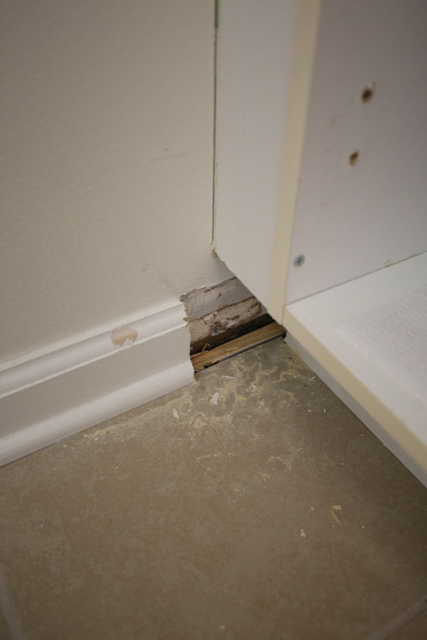 adjacent wall baseboard cut out for new kitchen island baseboard