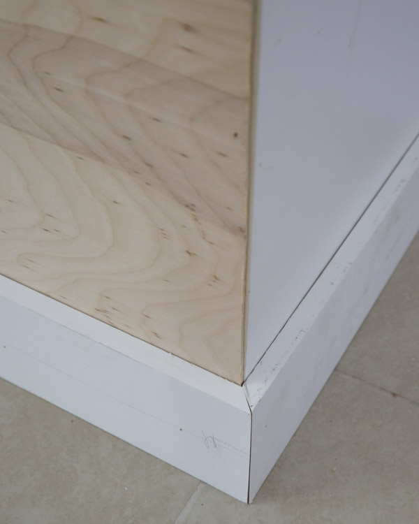 kitchen island baseboard corners lined up with a bevel cut