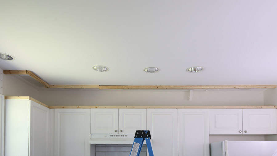 framing out the empty space above the kitchen cabinets to the enclose the space