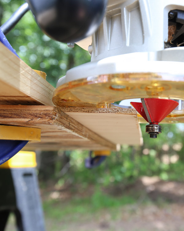 adding a 45 degree edge to plywood board side with router and chamfer bit