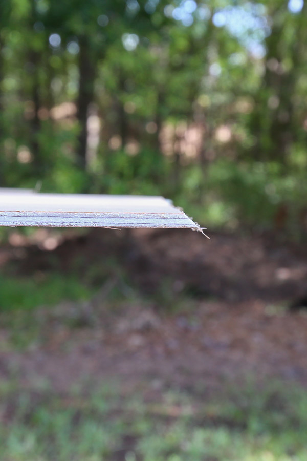 adding a 45 degree edge to plywood board side with router and chamfer bit