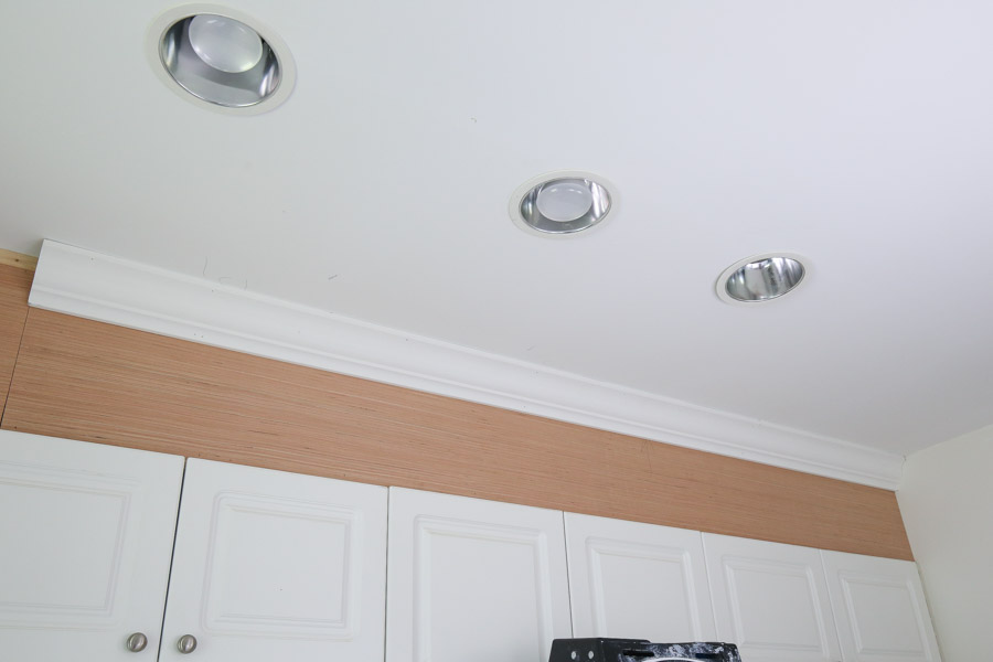 attach crown molding to ceiling and cabinet enclosure 