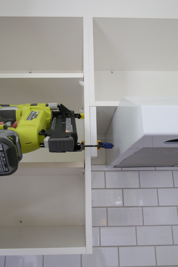 Add side cabinet trim with brad nailer