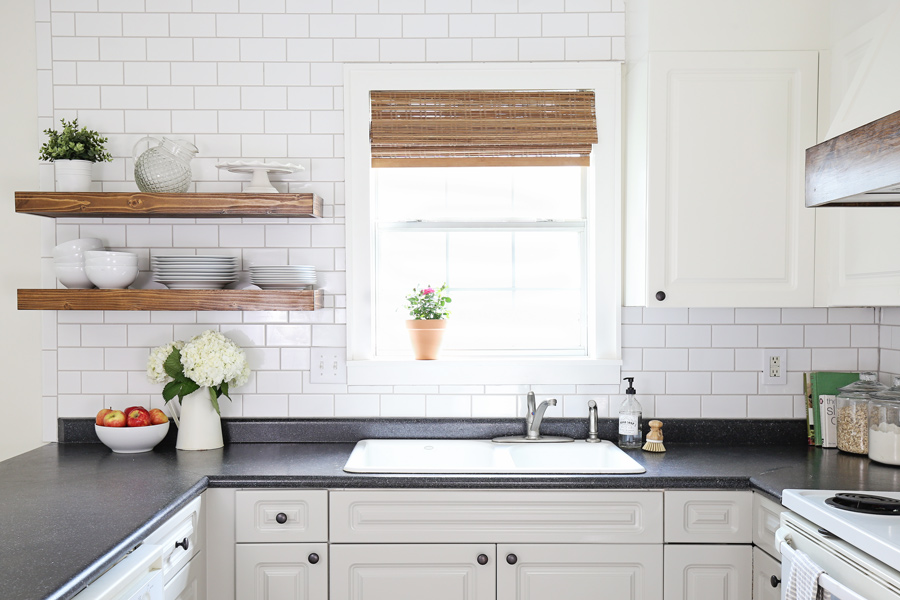 wood kithcen floating shelves and subway tile with warm gray grout