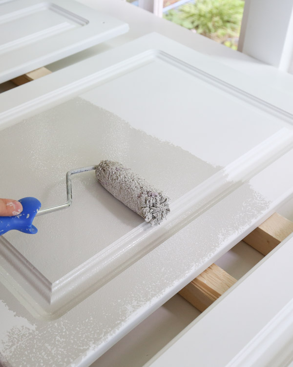 painting kitchen cabinets with a paint roller