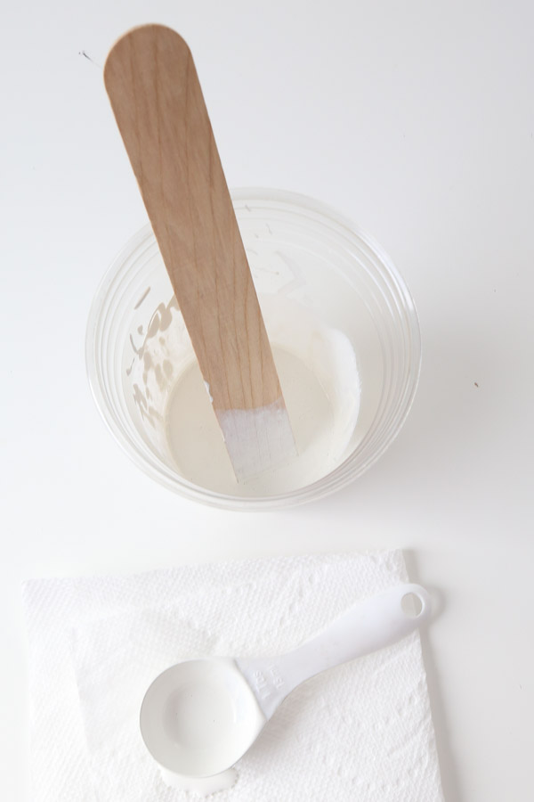 mixing together whitewash paint mixture