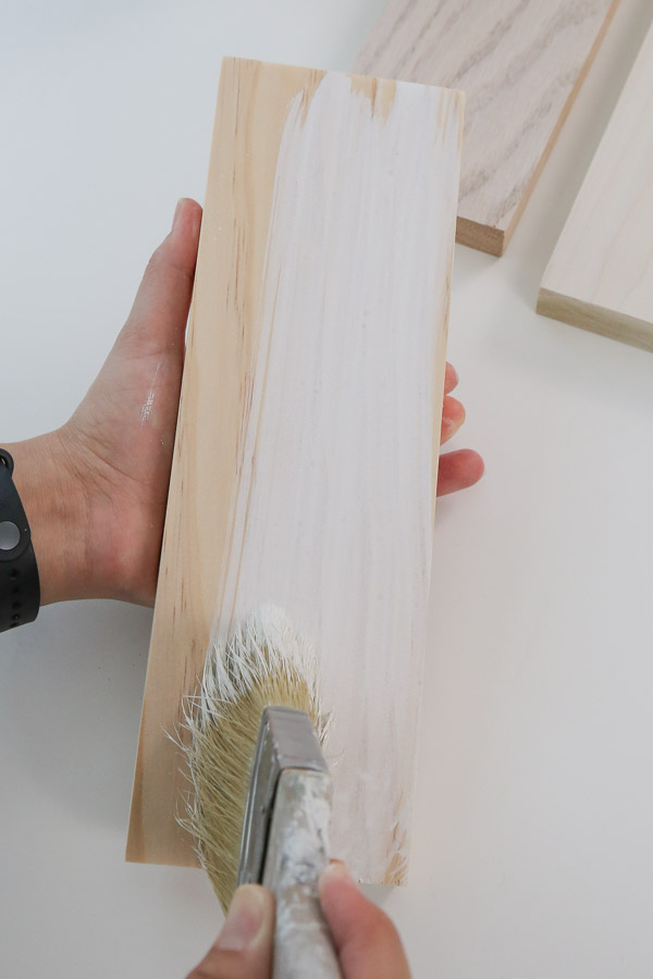 applying whitewash to raw wood