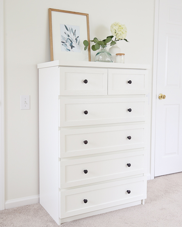 White dresser with store black handles