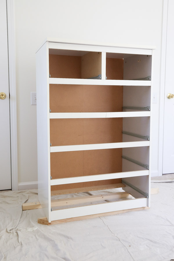 Prep dresser for makeover with drop cloth and boards under it