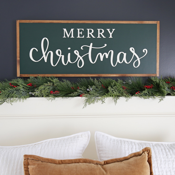 diy wooden christmas sign over bed