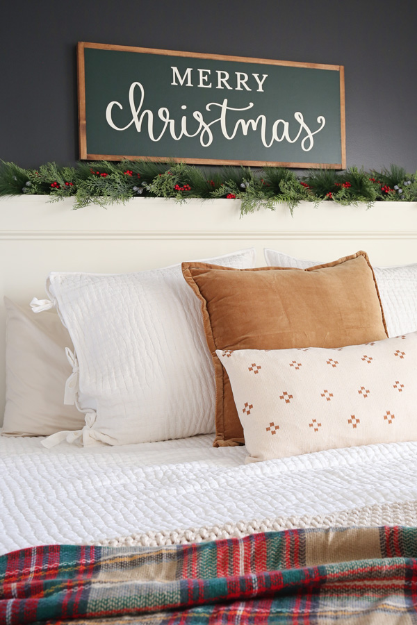 Merry Christmas sign DIY over bed with garland