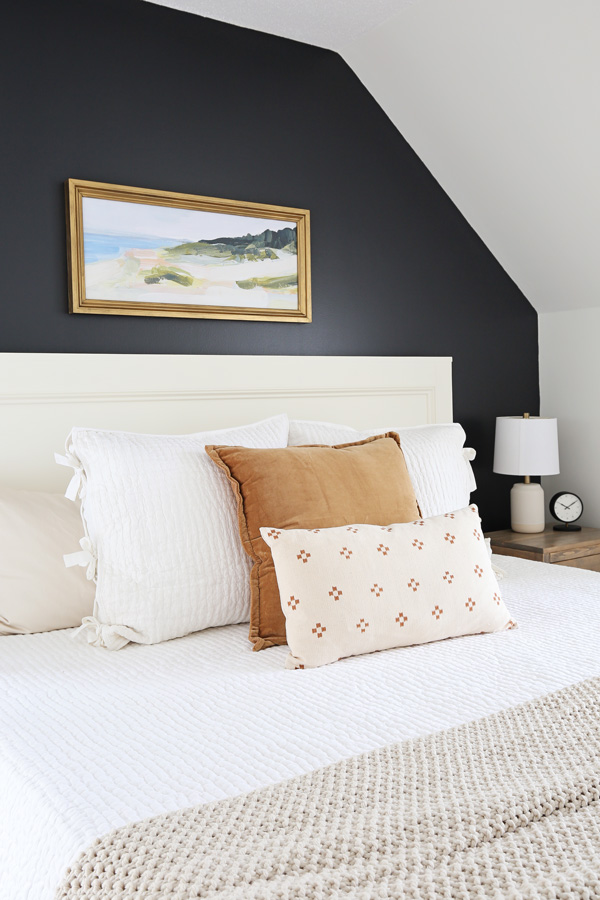 cozy white, brown, and natural bedding in DIY bedroom makeover