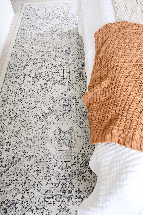 black grey and white rug in bedroom makeover