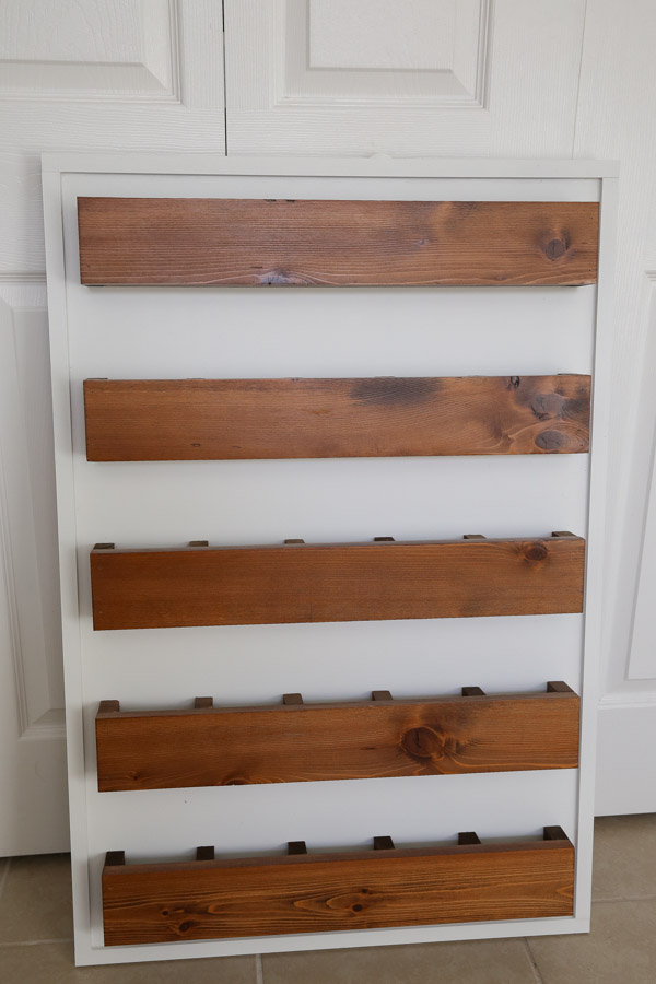 cubby shelves attached to wooden DIY advent calendar before numbers