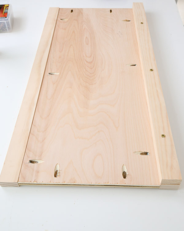 attach bottom 1x2 board to toy box front and back to create bottom slat supports