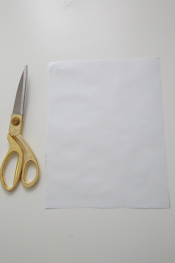 Cut the freezer paper to size with scissors