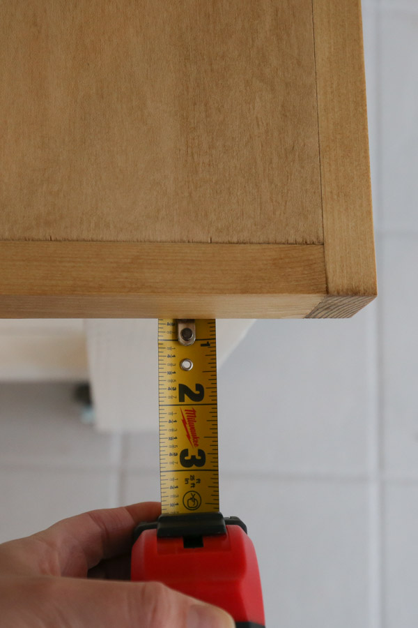 attach workbench top to frame with a 3/4" overhang on 4x4 legs