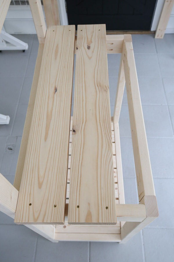 installing middle shelf of potting bench with screws
