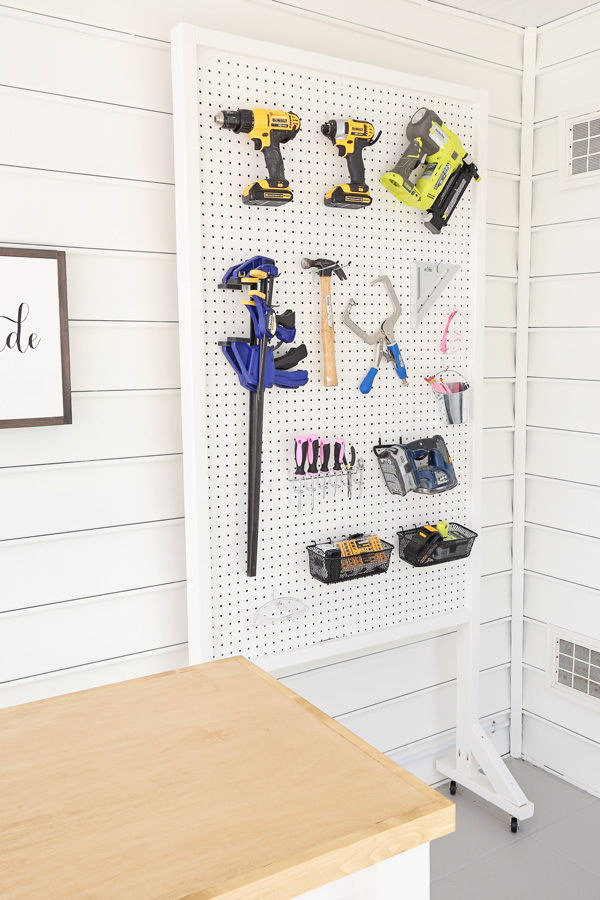 angle view of DIY pegboard stand on wheels for tools