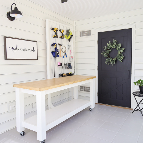 small workshop with tool organizaion and pegboard for tools and DIY workbench