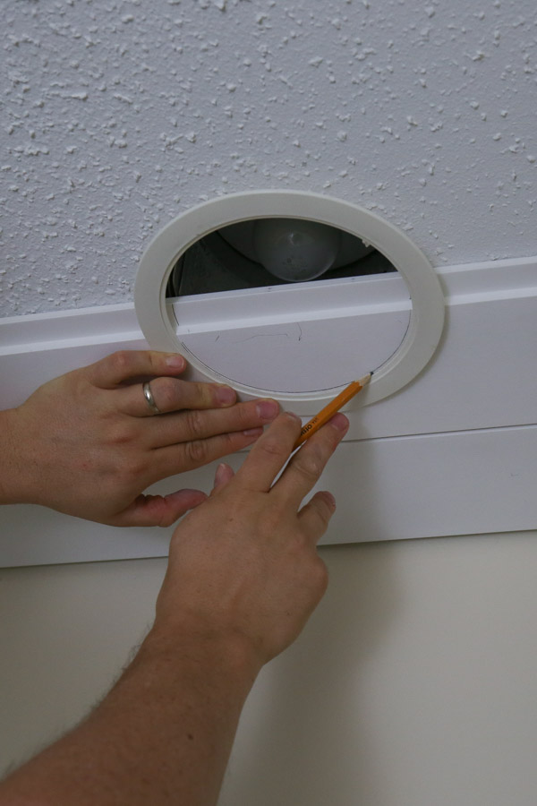 tracing light hole onto shiplap board