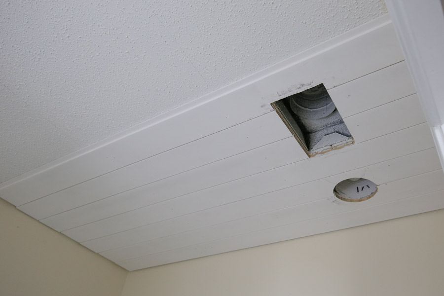 DIY shiplap ceiling covering a popcorn ceiling with planks