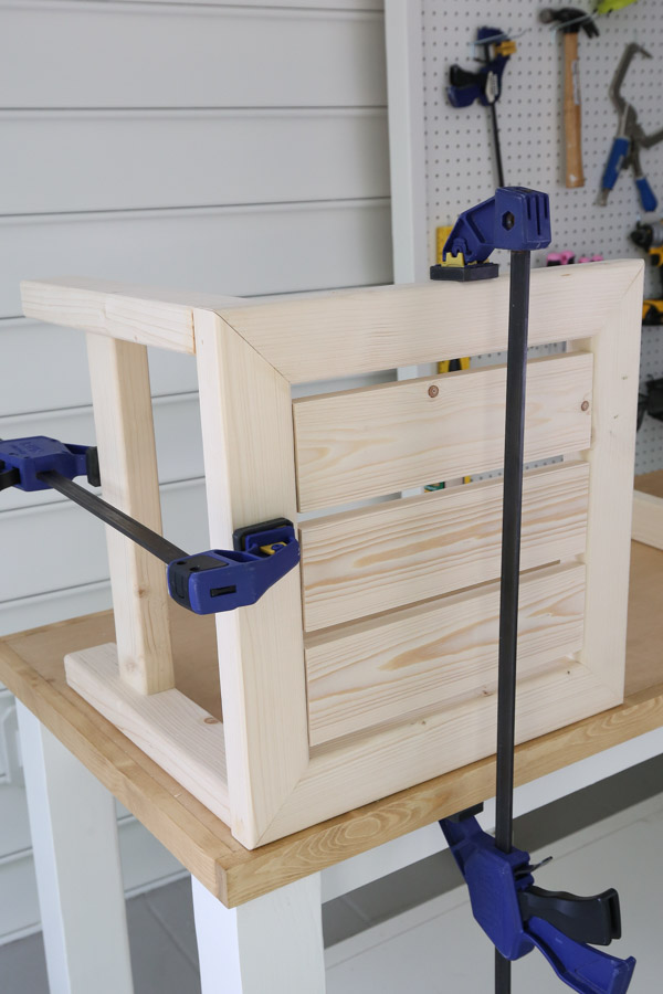 clamps holding table top and sides together for assembling