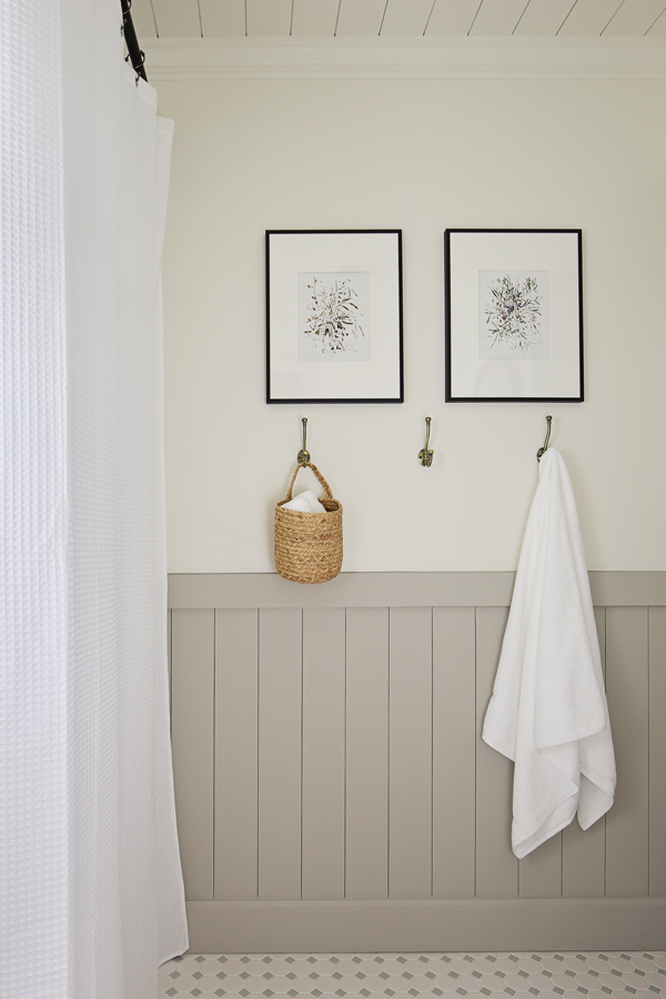 DIY vertical shiplap and art in bathroom makeover