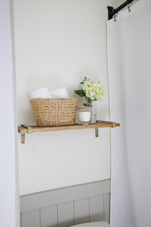 floating wood shelf with modern brass shelf brackets