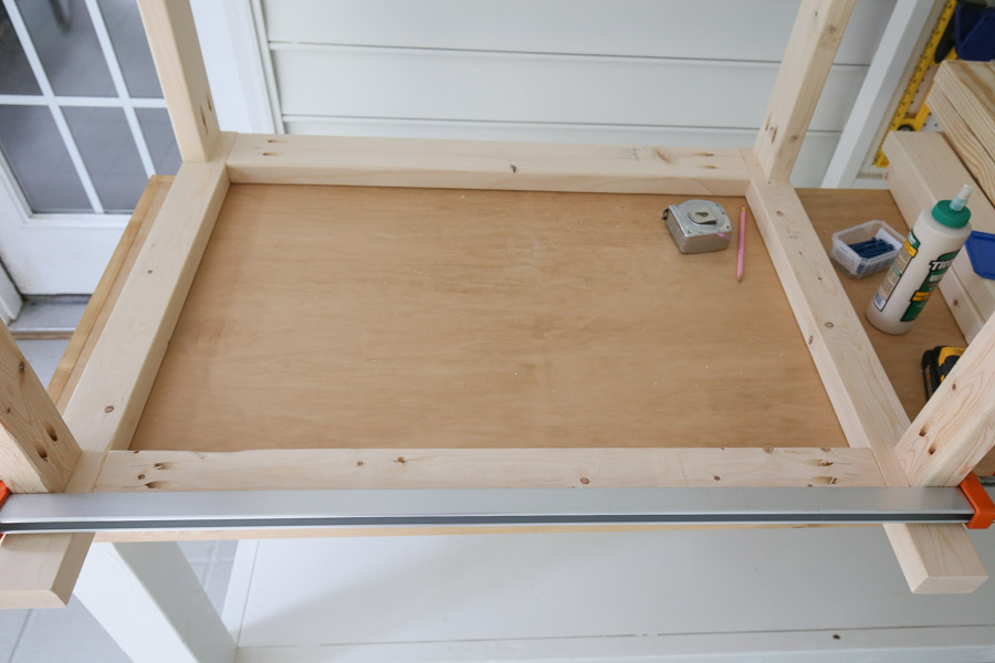 attach 2x3 with kreg screws to side frames to create the back of the cart
