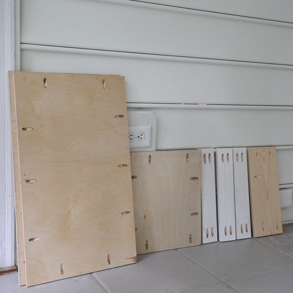 pocket holes drilled on cabinet door plywood boards