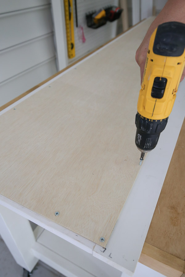 adding 1/4" plywood to back of cabinet door with screws and drill