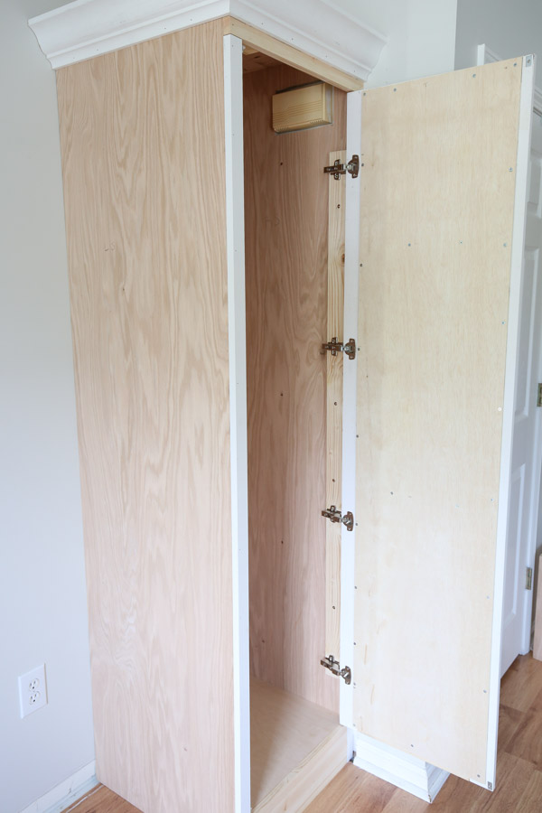 four inset european door hinges installed on DIY built in cabinet door