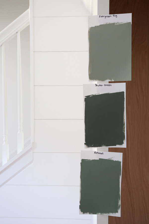 Paint samples of Sherwin Williams pewter green, retreat, and evergreen fog