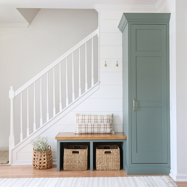 DIY entryway makeover with wood stained built in bench and built in cabinet  painted Sherwin Williams Retreat