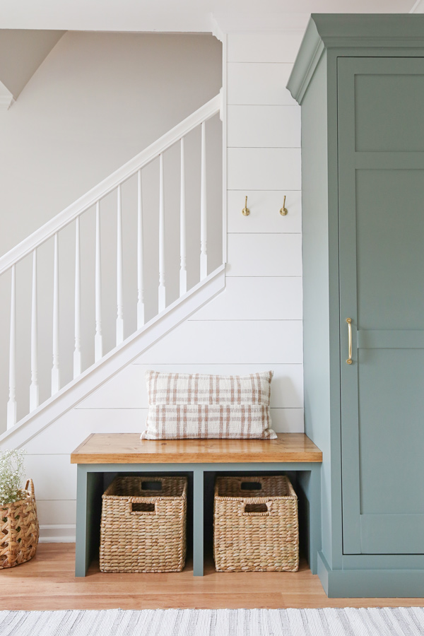 green DIY entryway built ins with shiplap wall painted simply white by benjamin moore