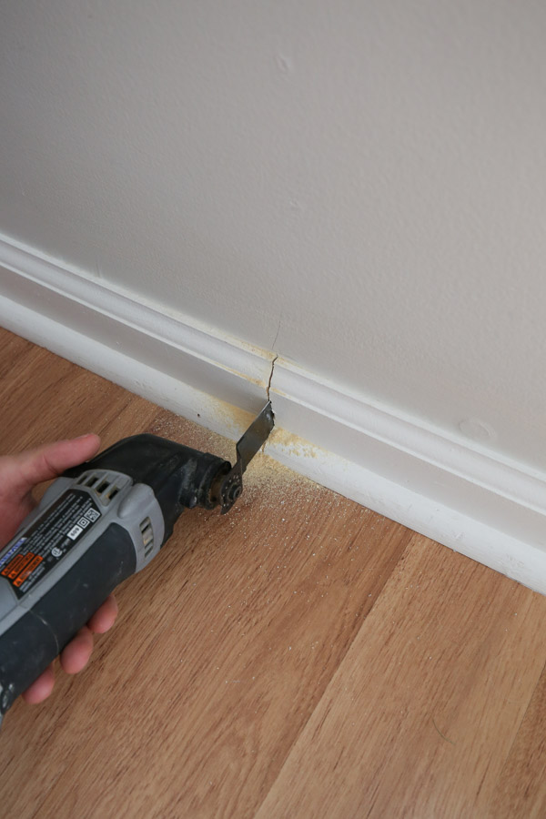 Dremel tool cutting baseboard