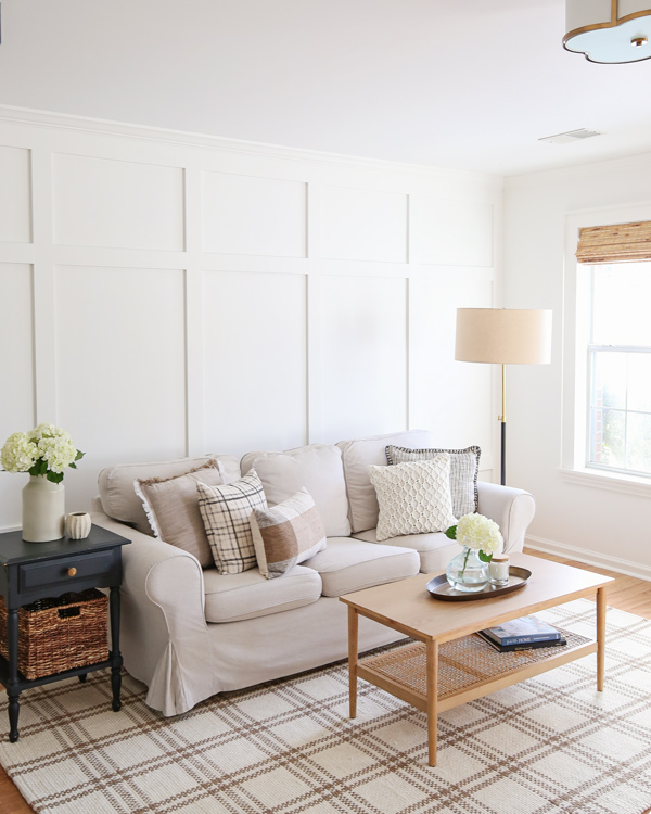 floor to ceiling board and batten accent wall with crown molding in living room makeover