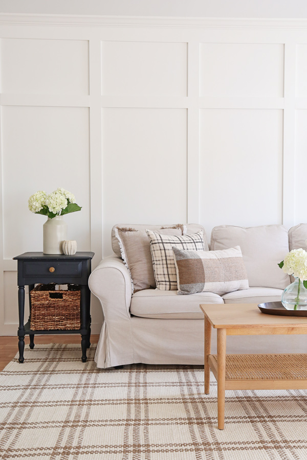 DIY board and batten accent wall and black side table in living room makeover