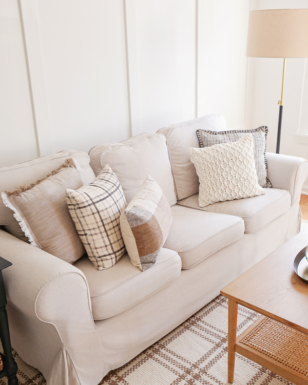 neutral brown, white, and black throw pillows