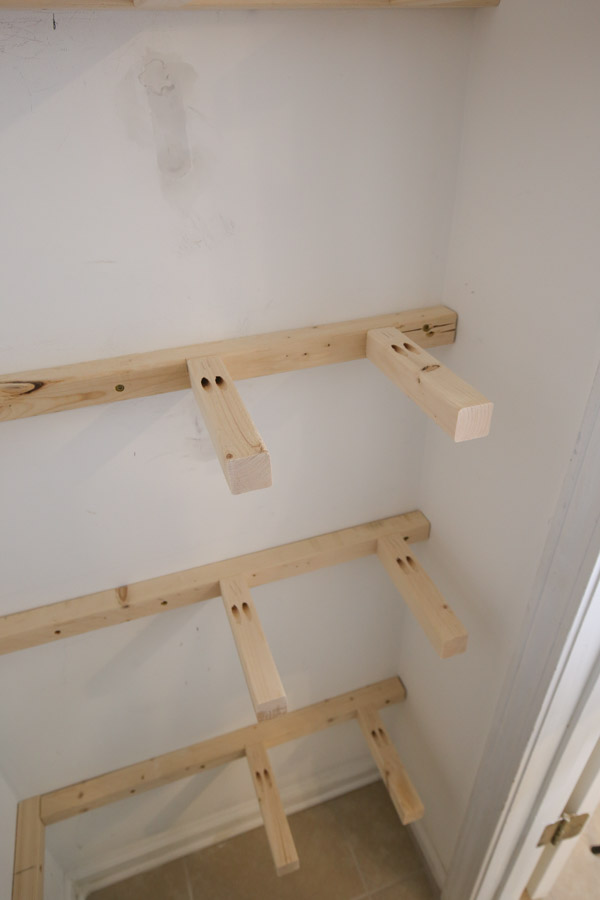 2x2 middle support brackets installed with pocket holes on pantry wall