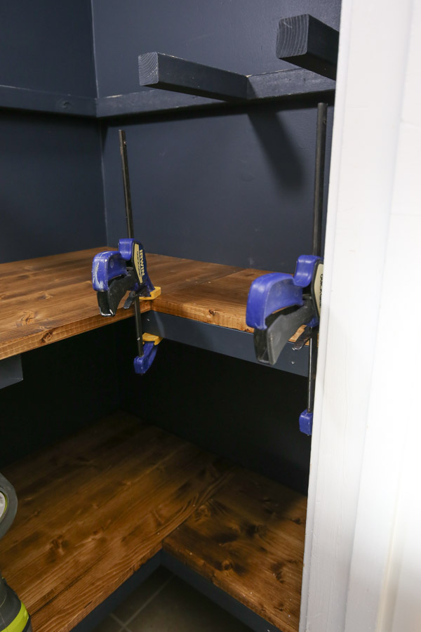 how to build corner pantry shelves using clamps to help install shelves and trim