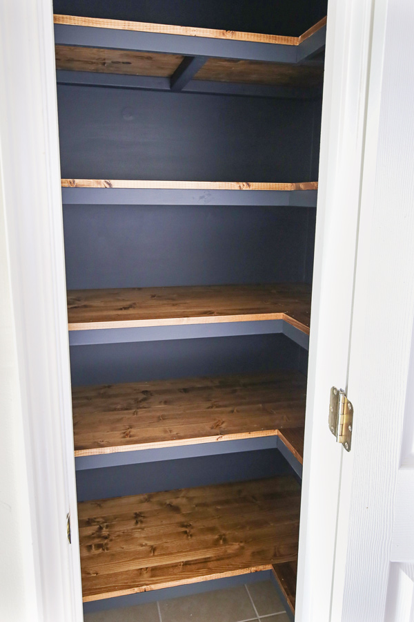 diy corner closet shelves with dark paint and wood shelves