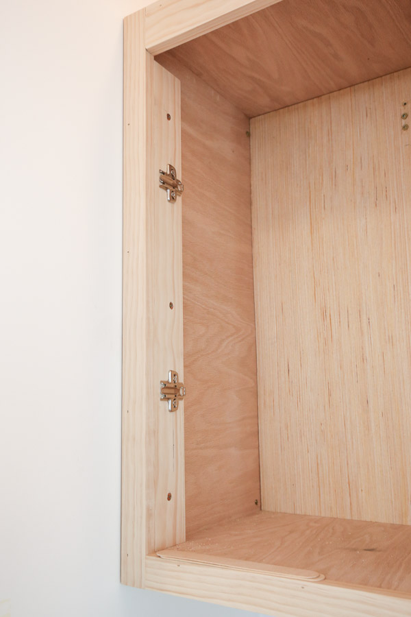 installing hinge plates to inside of diy wall cabinet