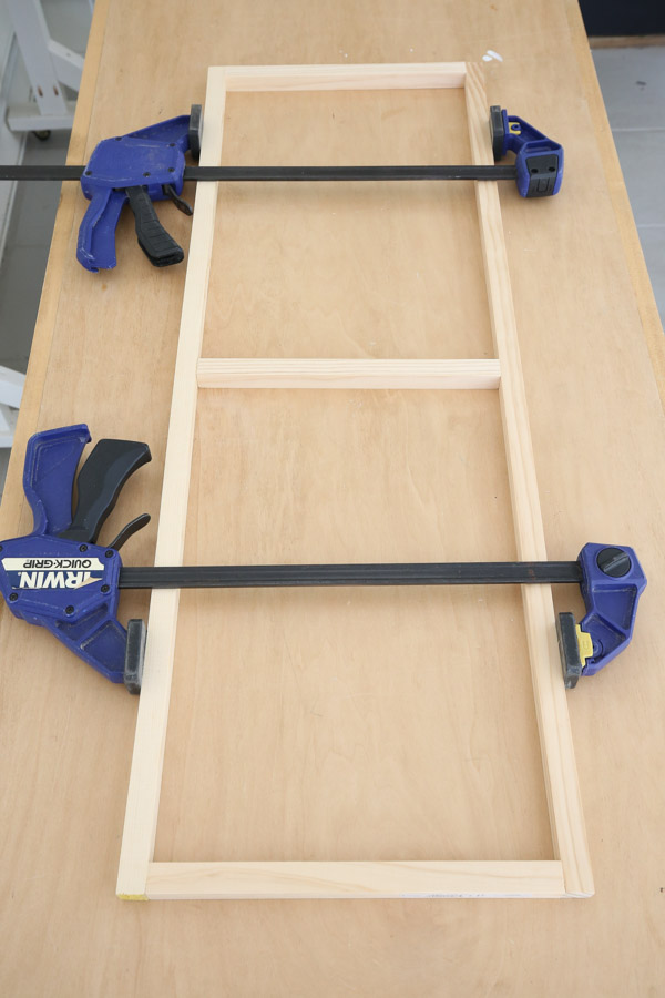 using clamps to build the frame of the thin floating shelf DIY