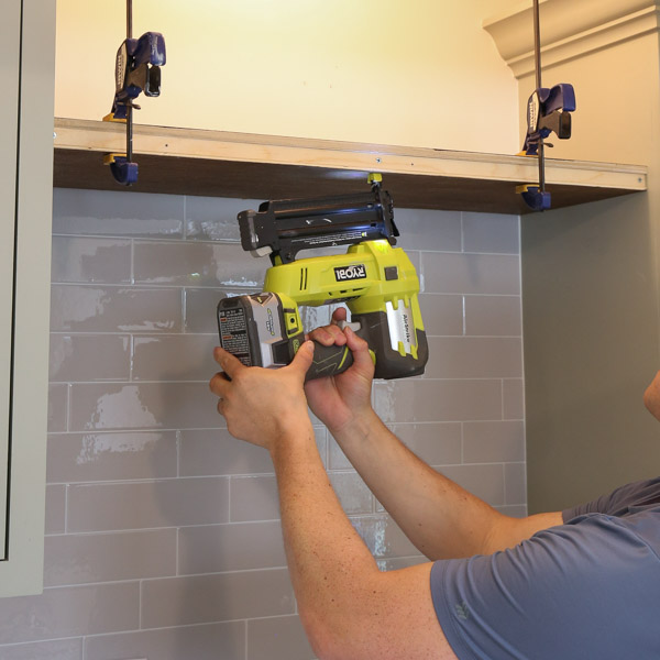 using a brad nailer to attach plywood to frame of thin floating shelf DIY