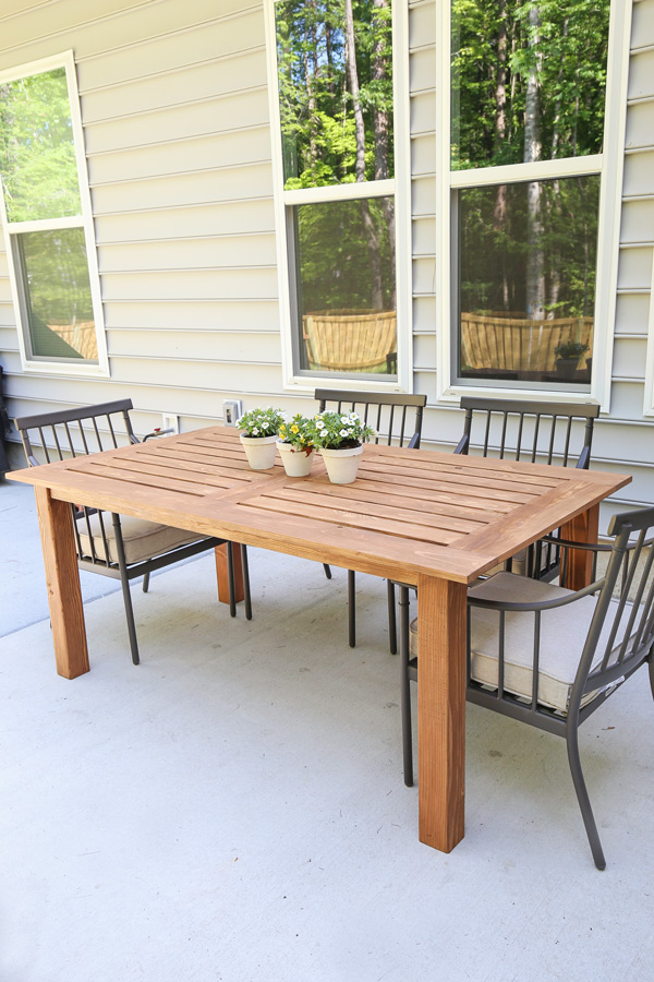 diy outdoor table with outdoor dining chairs on patio