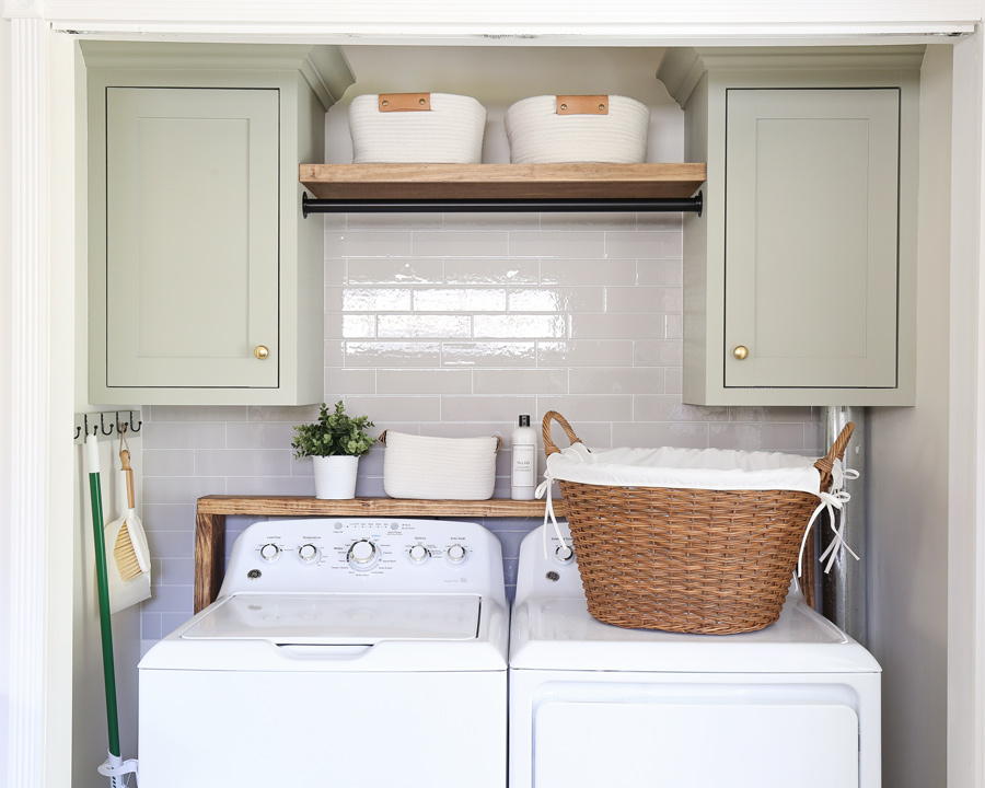 DIY wall cabinets painted October Mist by Benjamin Moore in laundry room makeover